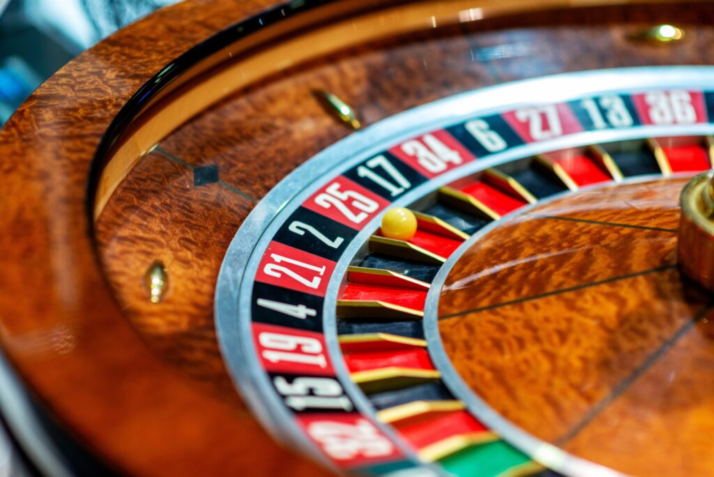 A close up photo of a roulette wheel in a casino.