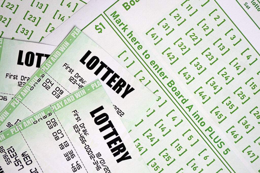 A close up photo of green lottery tickets.
