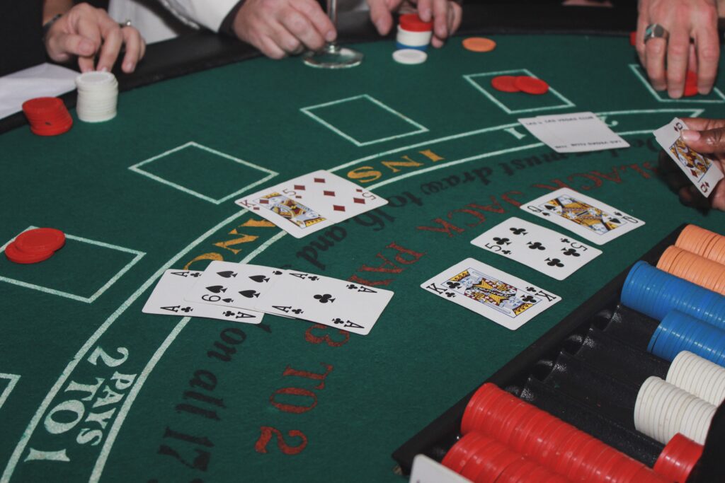 A photo of several people playing blackjack.