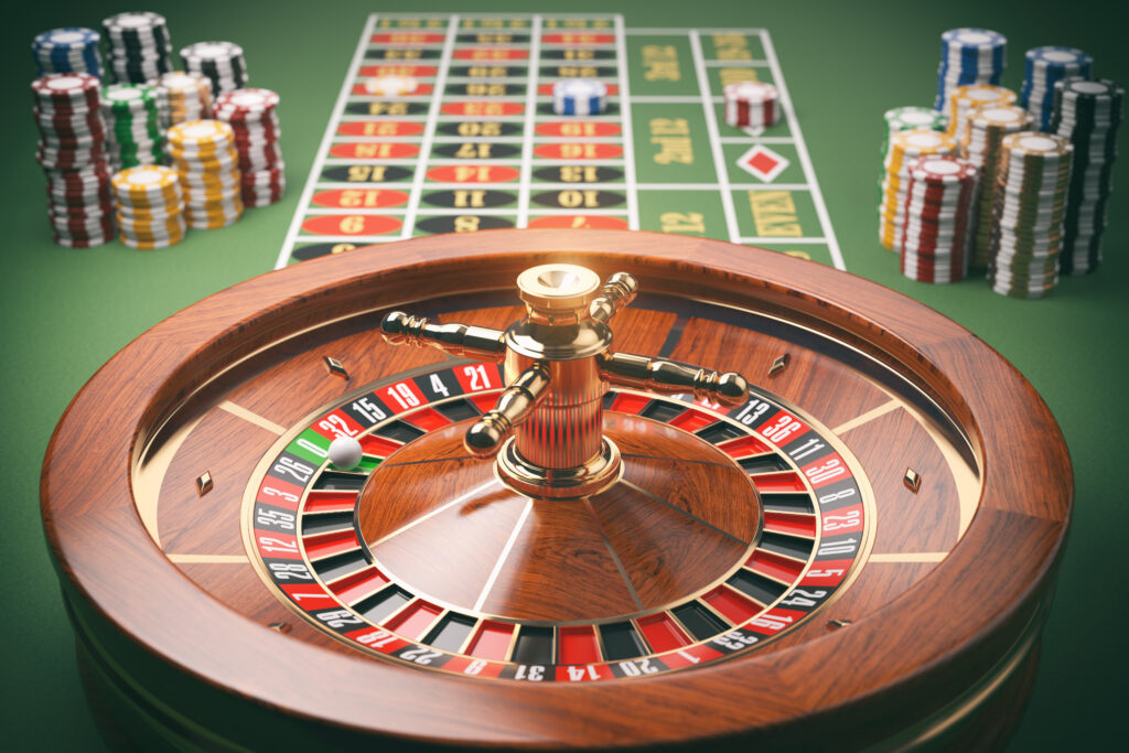 A photo of a roulette wheel with the table in the background.
