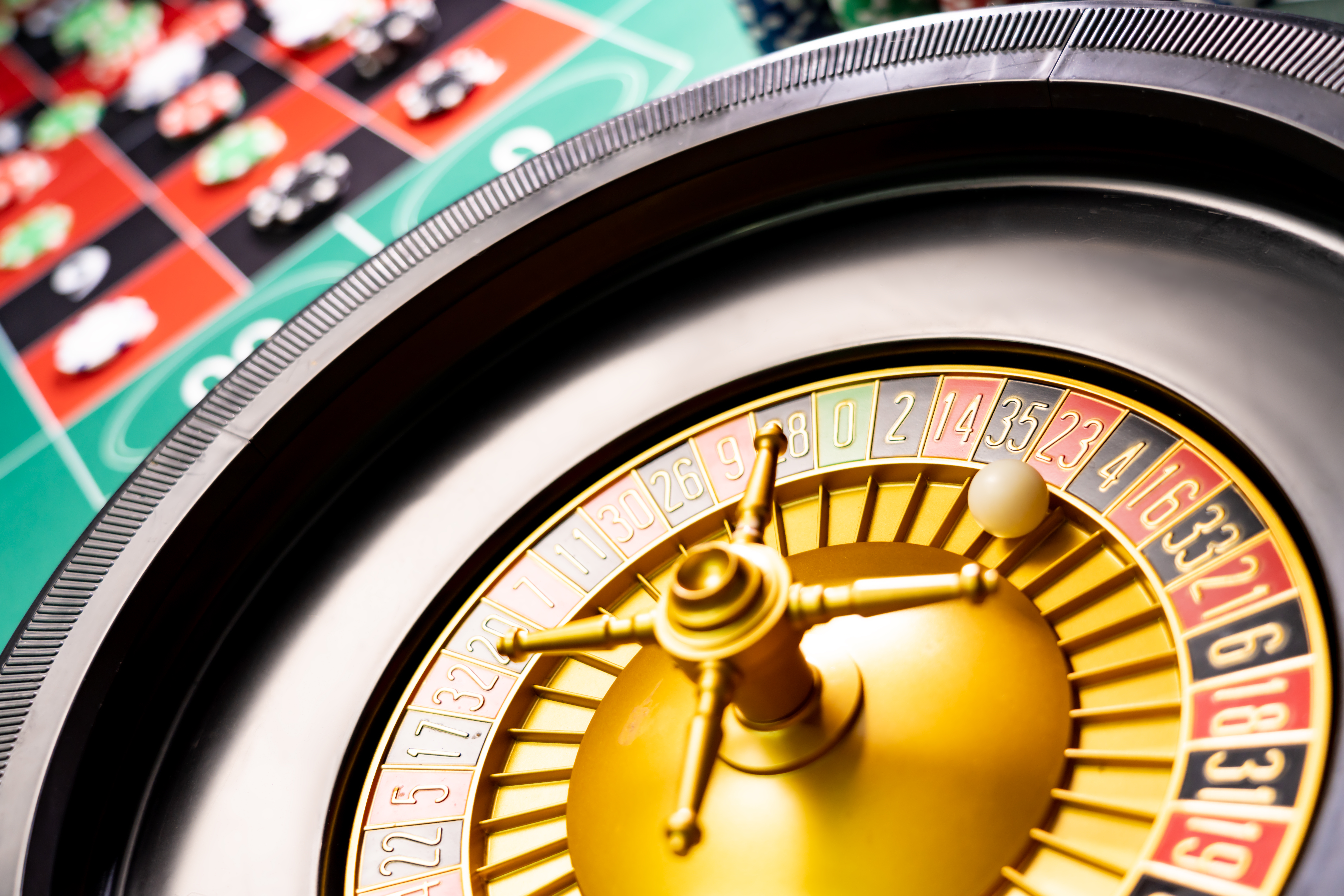 Close up of a roulette wheel on a roulette table at a casino.