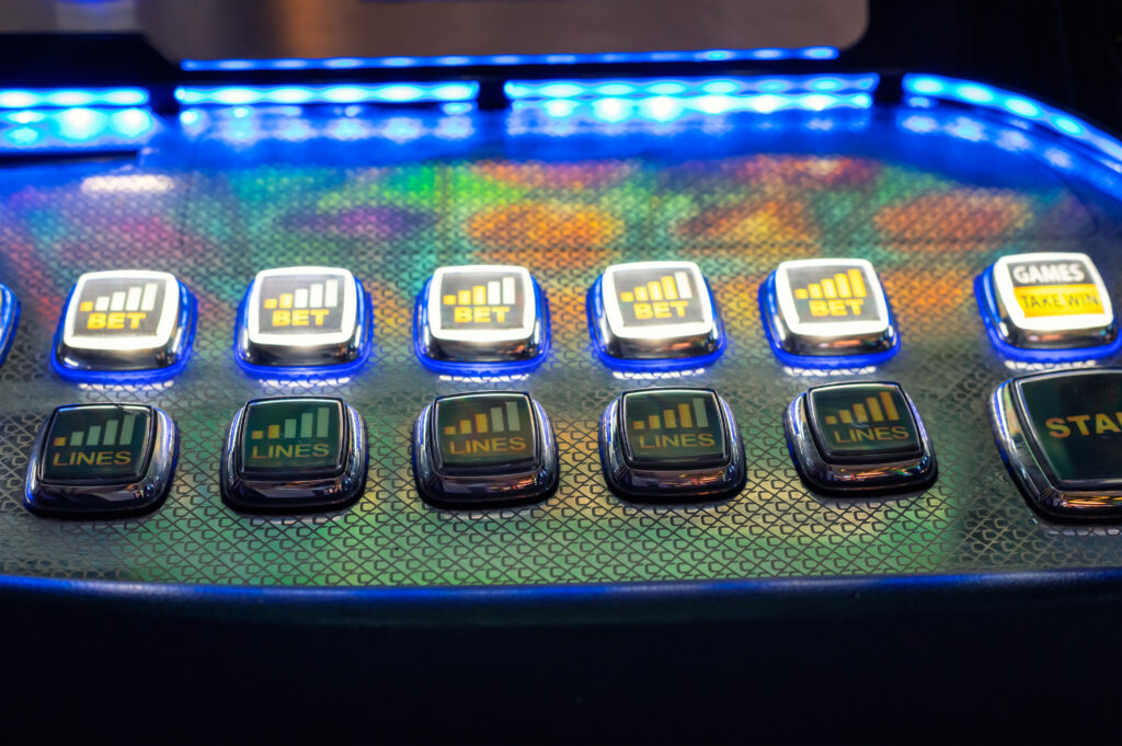Close up of buttons on a slot machine's control panel.